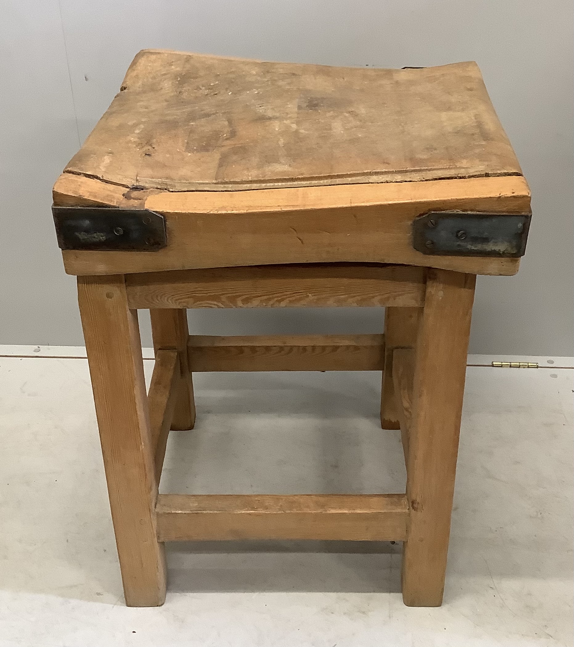 A Victorian iron bound butcher's block on pine stand, width 60cm, depth 61cm, height 81cm